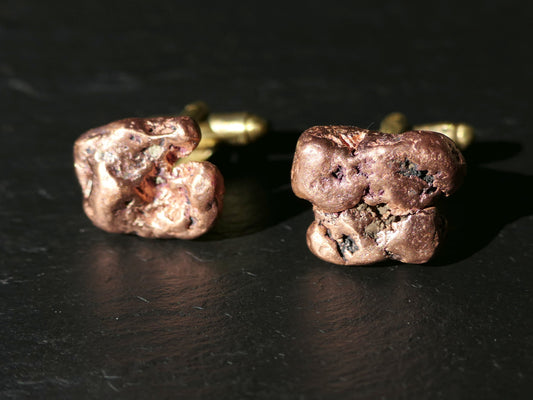 Michigan copper nugget cufflinks with natural copper nuggets and brass backs on dark surface