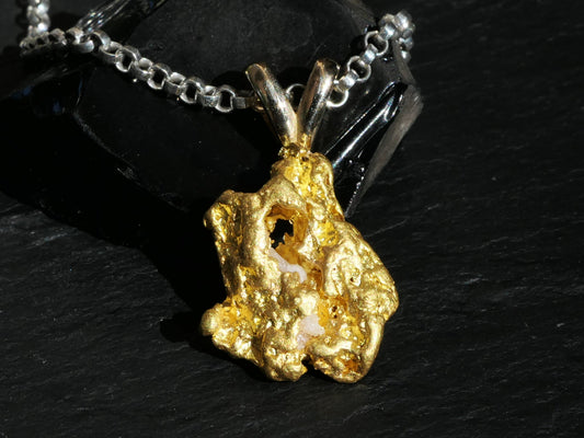 Large raw Yukon gold nugget pendant necklace with embedded quartz on silver chain