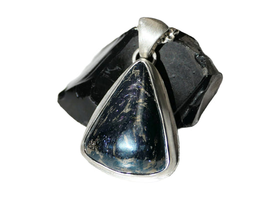 Sterling silver pendant with large Montana covellite gemstone featuring dark blue and gold swirls in a triangular bezel setting.