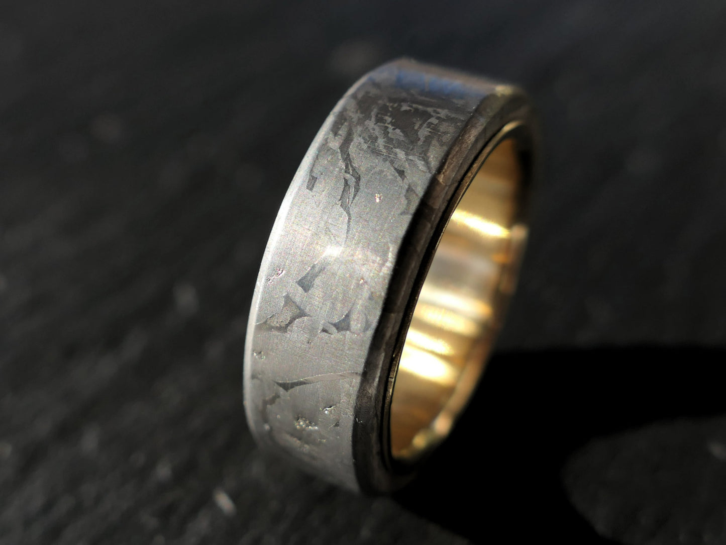 gold meteorite wedding band with Muonionalusta pattern and 18k yellow gold interior