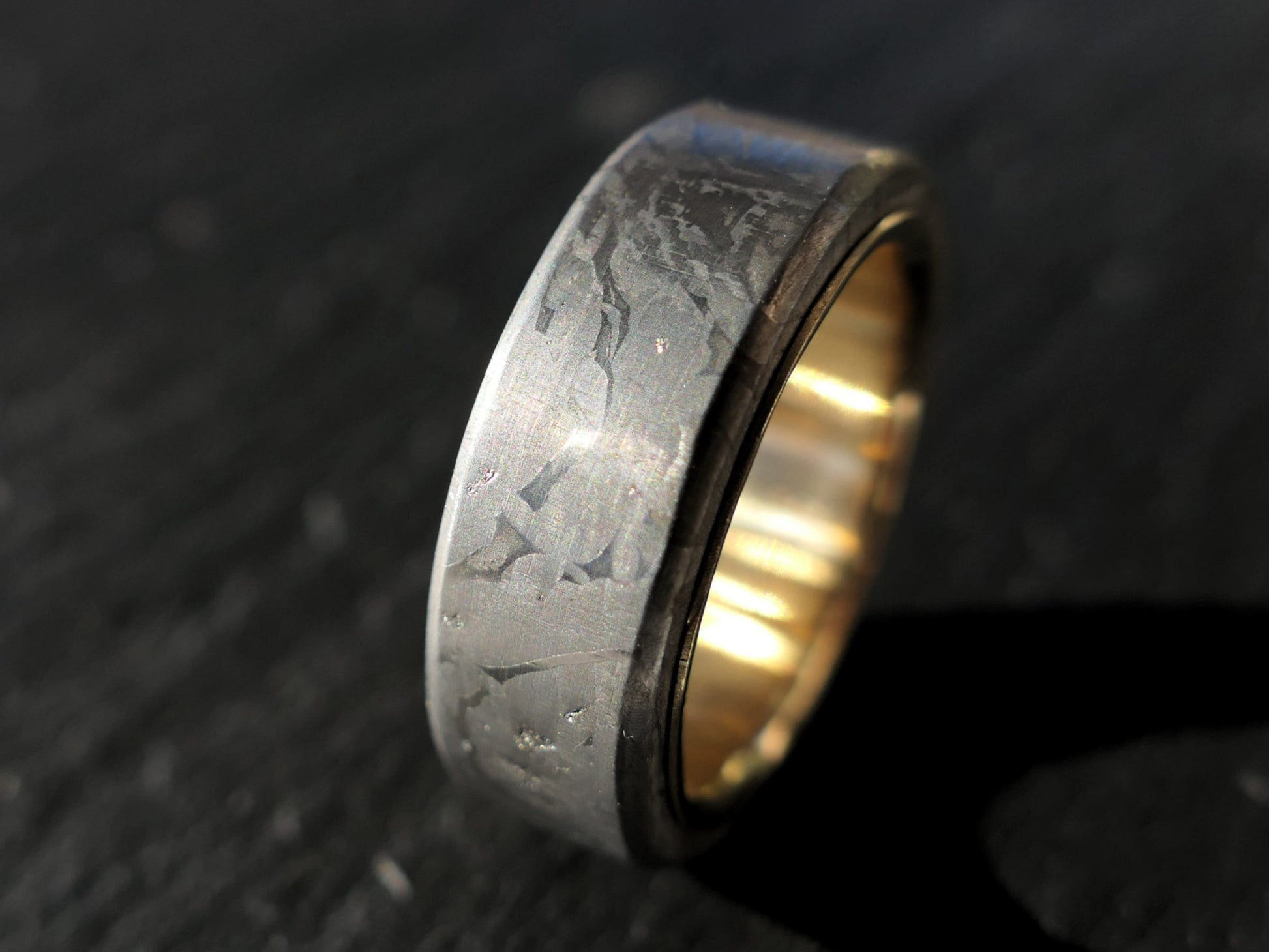 gold meteorite wedding band with Muonionalusta pattern and 18k yellow gold interior