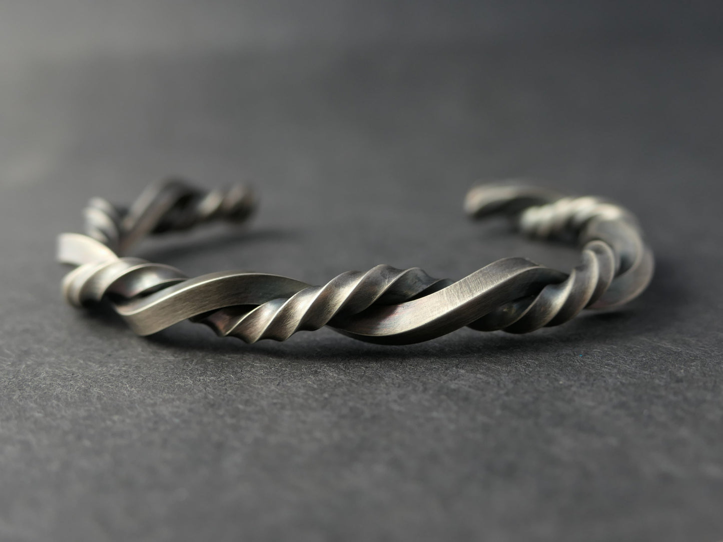 twisted sterling silver cuff bracelet with oxidized braid design and adjustable open gap