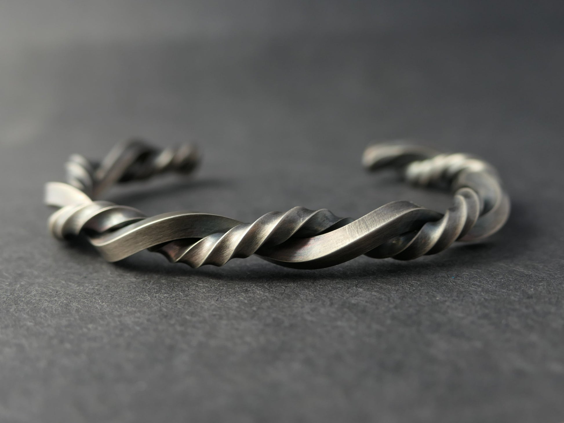 twisted sterling silver cuff bracelet with oxidized braid design and adjustable open gap