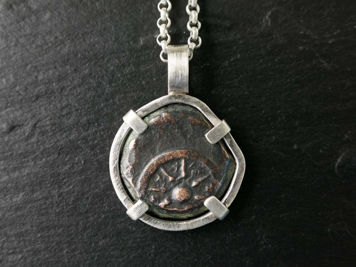 Sterling silver pendant featuring a genuine ancient widows mite bronze coin with 8-ray star design.