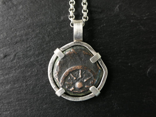 Sterling silver pendant featuring a genuine ancient widows mite bronze coin with 8-ray star design.