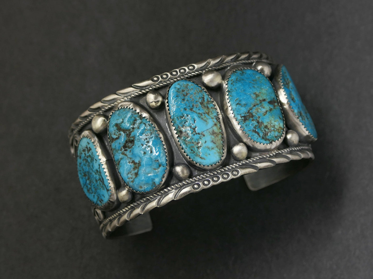 wide turquoise bracelet with five genuine Kingman turquoise stones set in a sterling silver Navajo cuff
