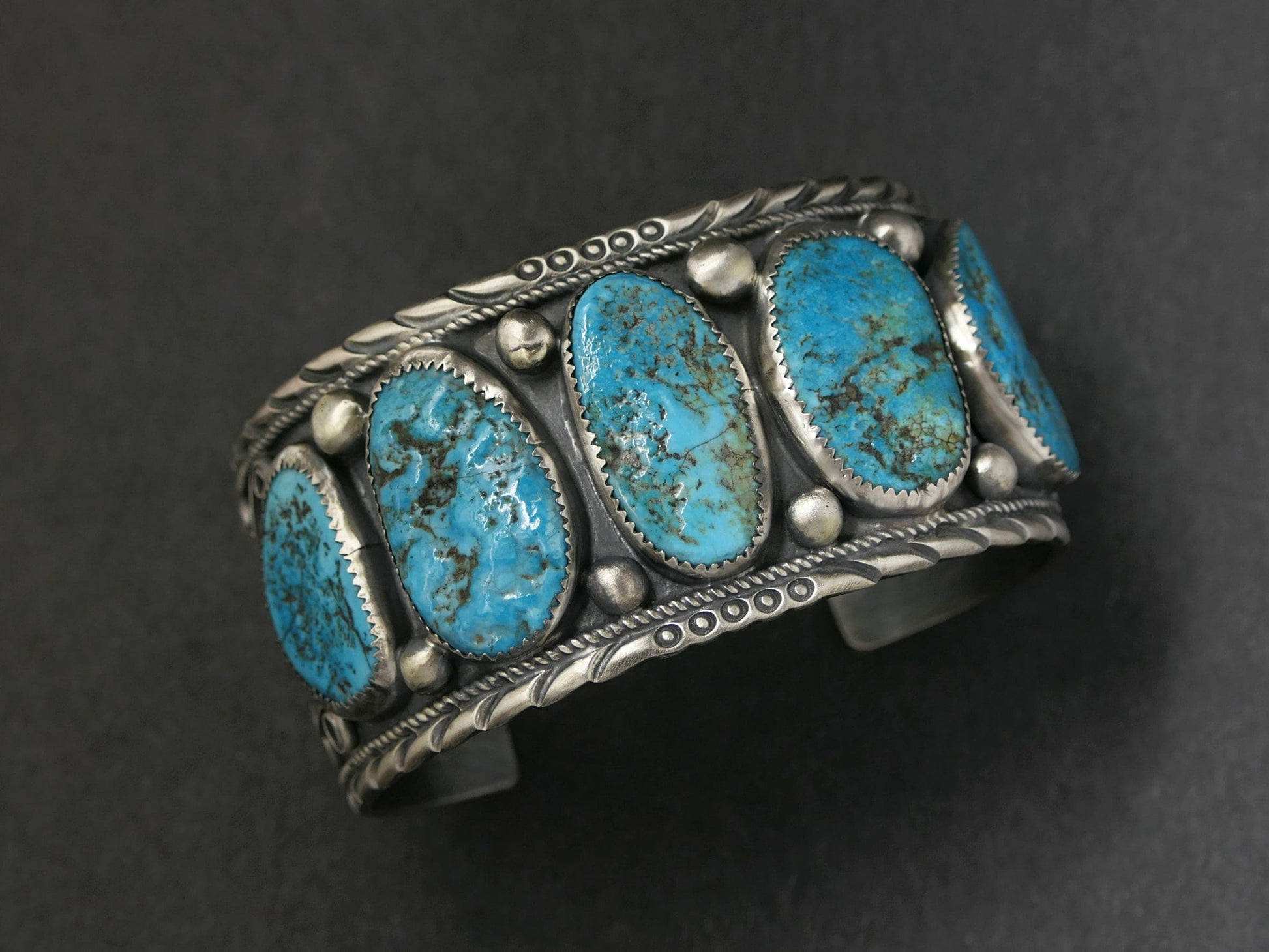 wide turquoise bracelet with five genuine Kingman turquoise stones set in a sterling silver Navajo cuff