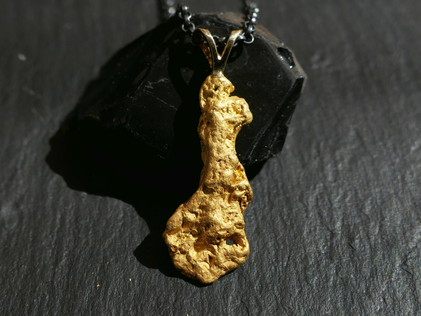 real gold nugget pendant with natural rough texture on black sterling silver chain
