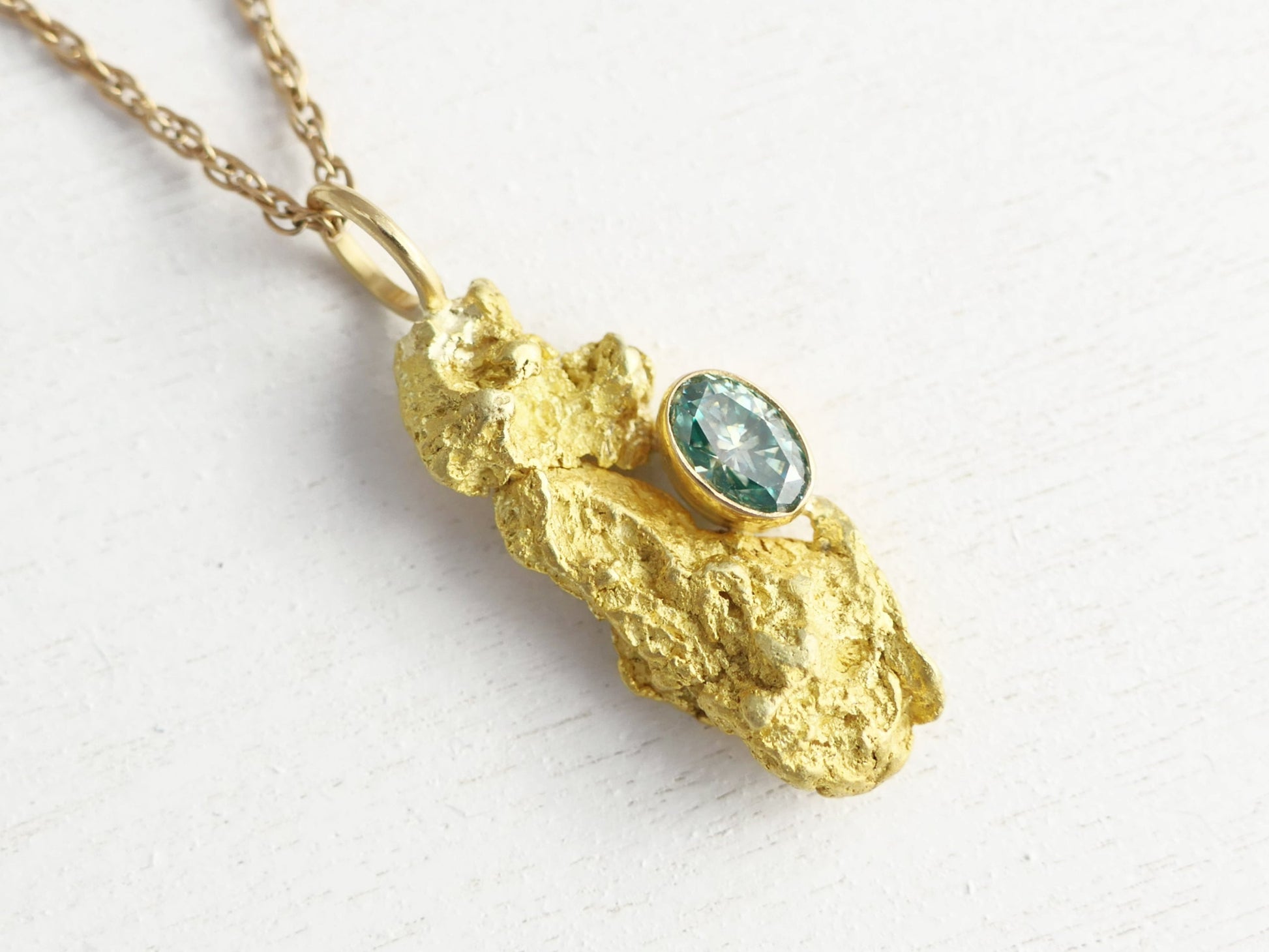 natural gold nugget pendant with blue diamond