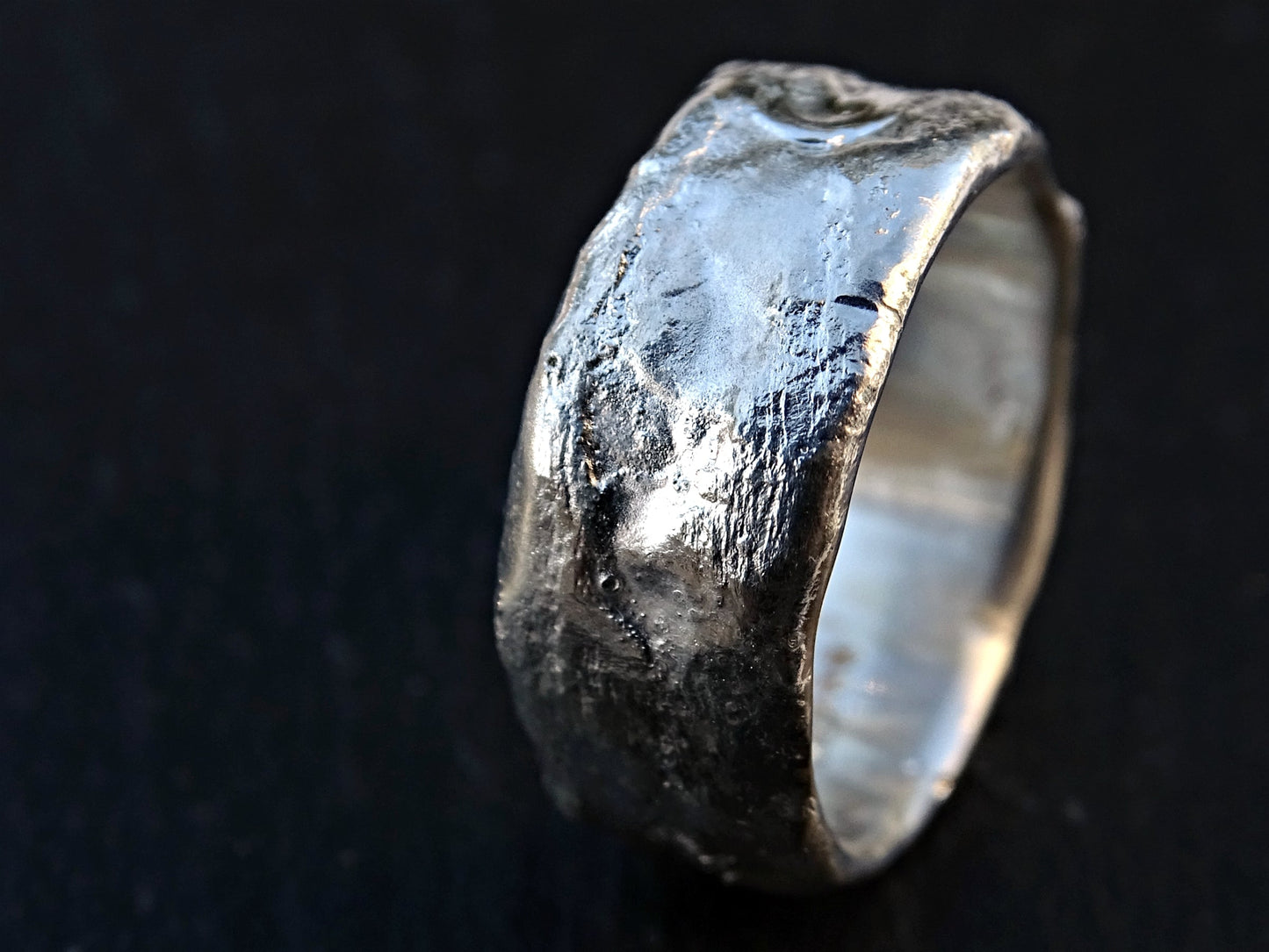 handmade unusual silver ring with molten texture and rustic design wedding band