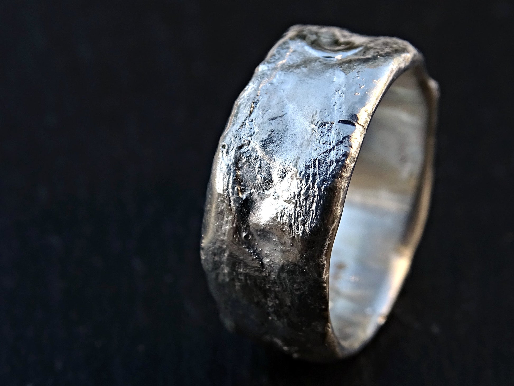 handmade unusual silver ring with molten texture and rustic design wedding band