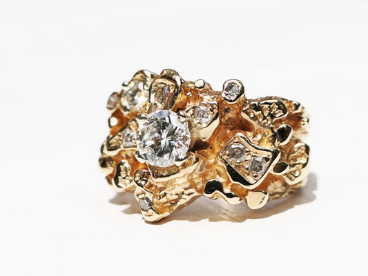 14k gold diamond statement ring with nine salt and pepper diamonds in unique settings