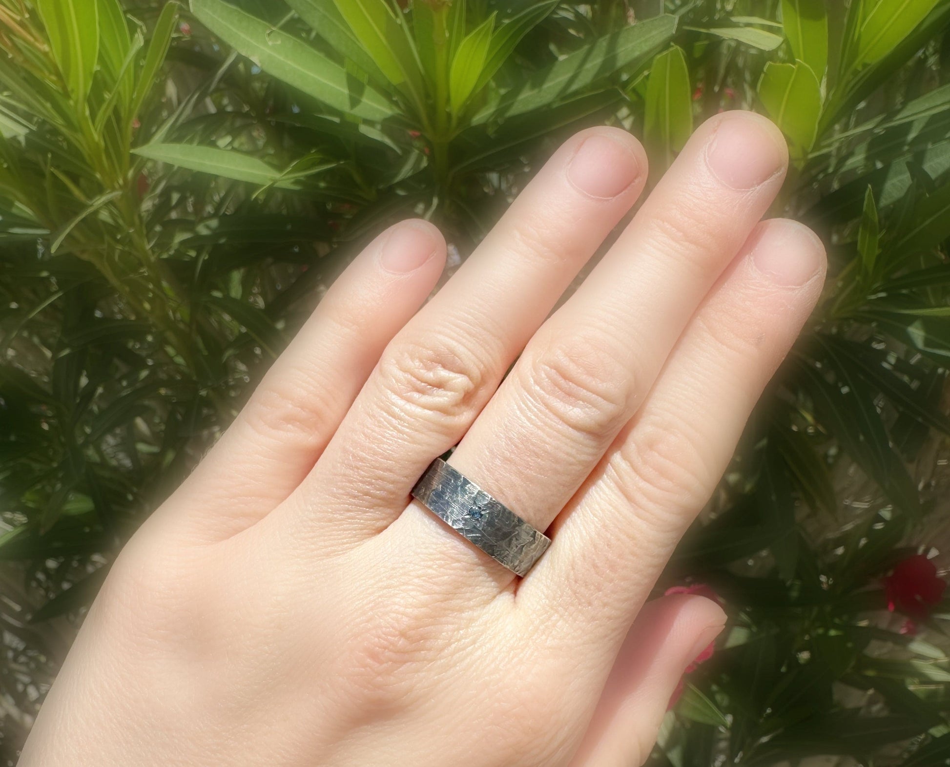 men's wedding band with a small gemstone