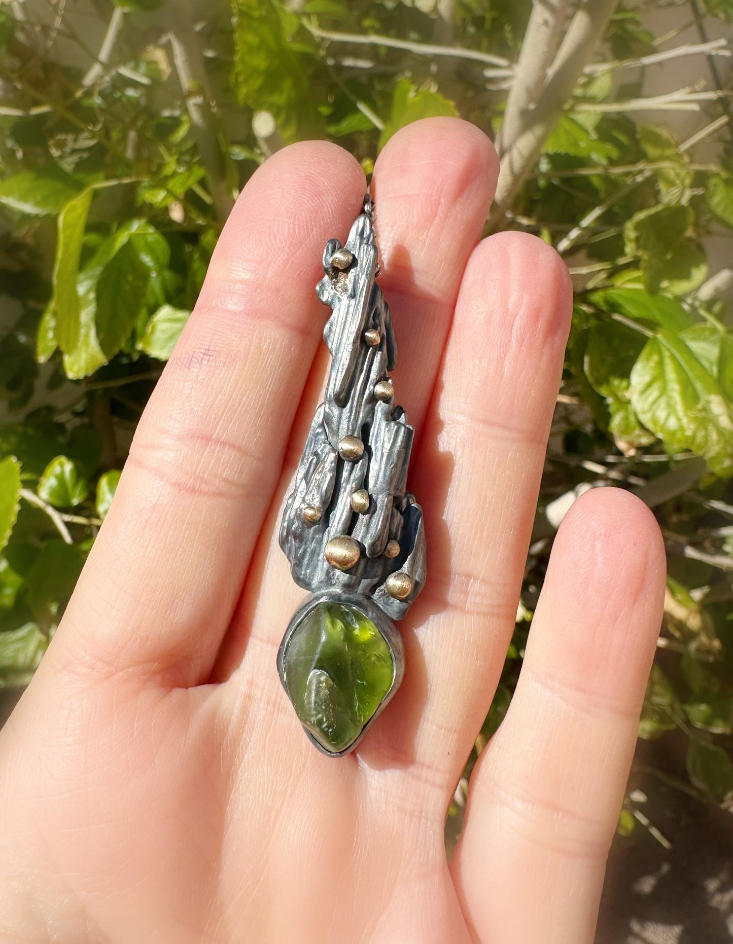 uncut peridot pendant