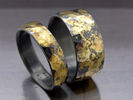 hammered ring set with dark silver and gold bands featuring unique hammered texture