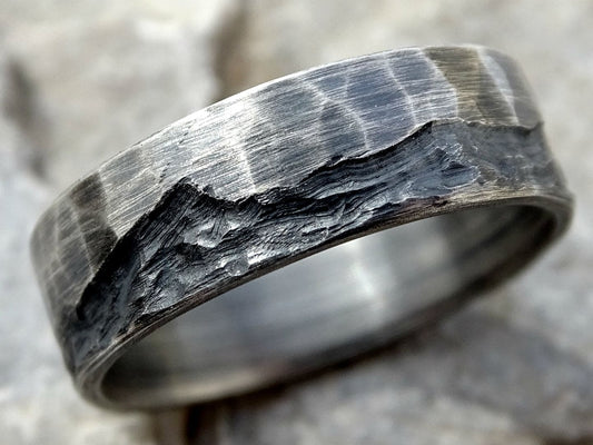 rustic hammered silver wave ring handforged from sterling silver with engraved wave design and textured finish