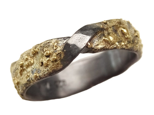 molten 14k gold and sterling silver infinity ring with hammered rustic texture and twisted moebius design