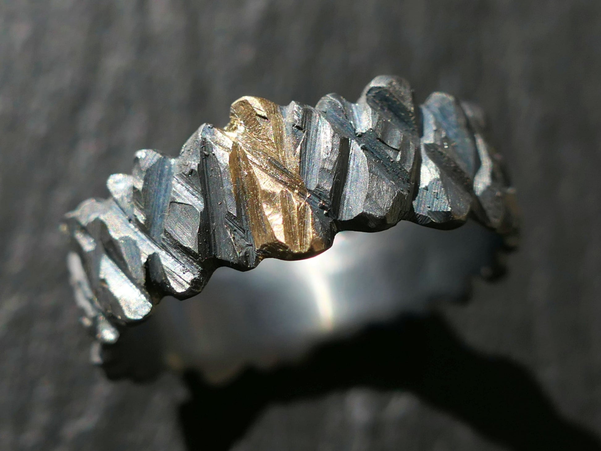 cool mens wedding ring with rugged hand carved sterling silver and solid gold center inlay