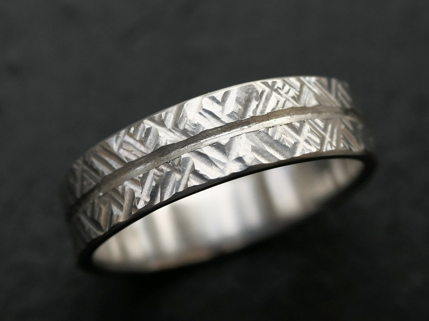 cross hammered sterling silver modern wedding band with engraved center line and textured finish