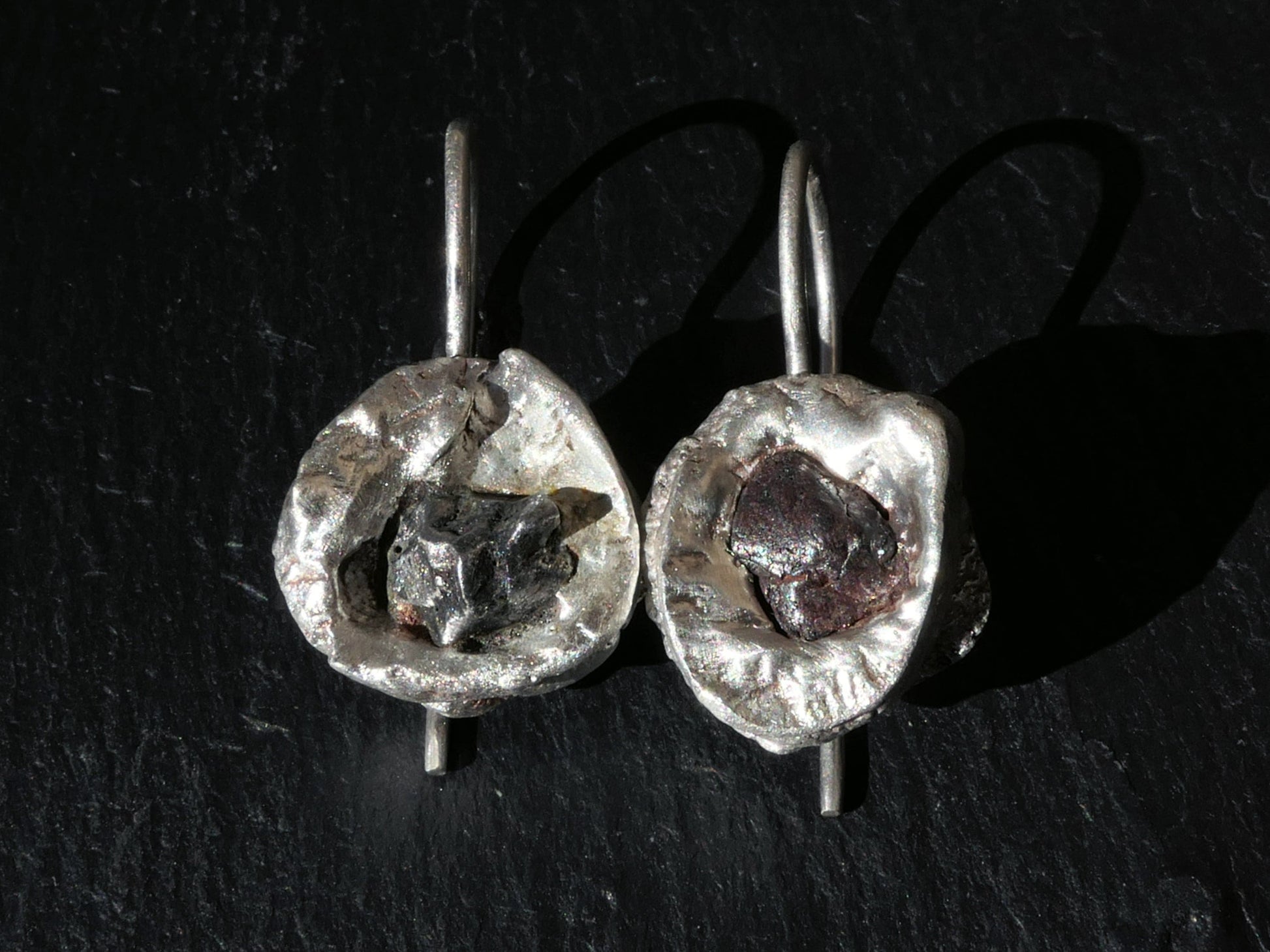 Handmade silver meteorite earrings with real Campo del Cielo meteorite pieces set in recycled sterling silver.