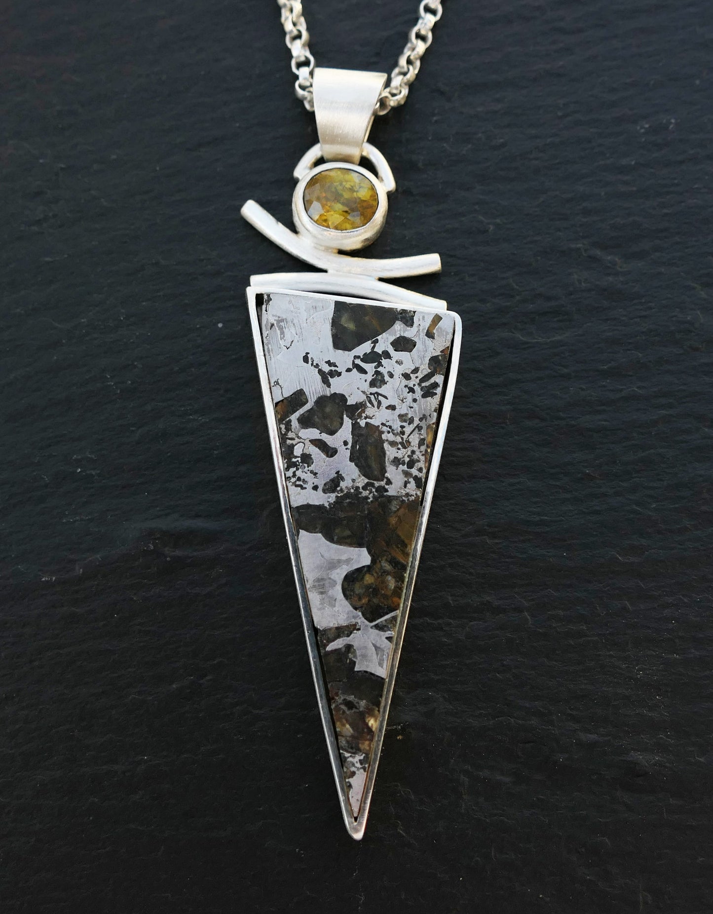 Large sterling silver necklace with triangle-shaped Pallasite meteorite pendant and round titanite gemstone