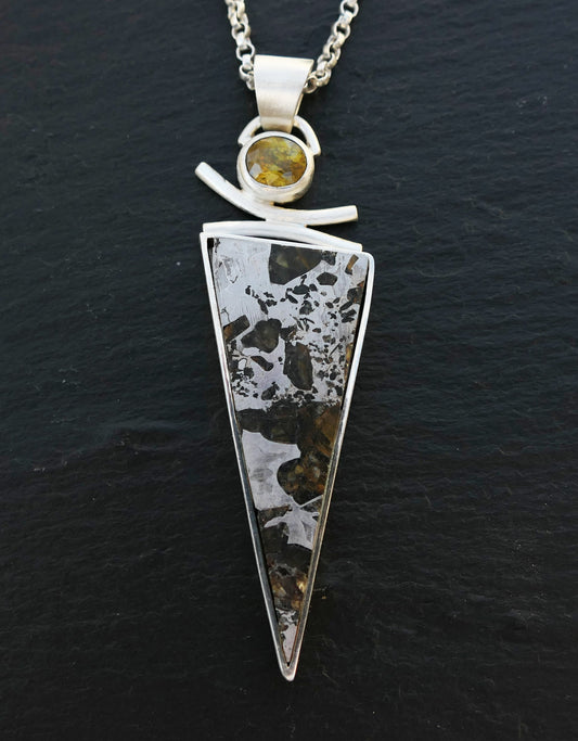 Large sterling silver necklace with triangle-shaped Pallasite meteorite pendant and round titanite gemstone