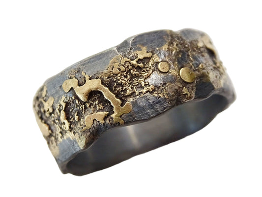 unique mens wedding ring with hammered molten gold and silver band handcrafted with a textured surface