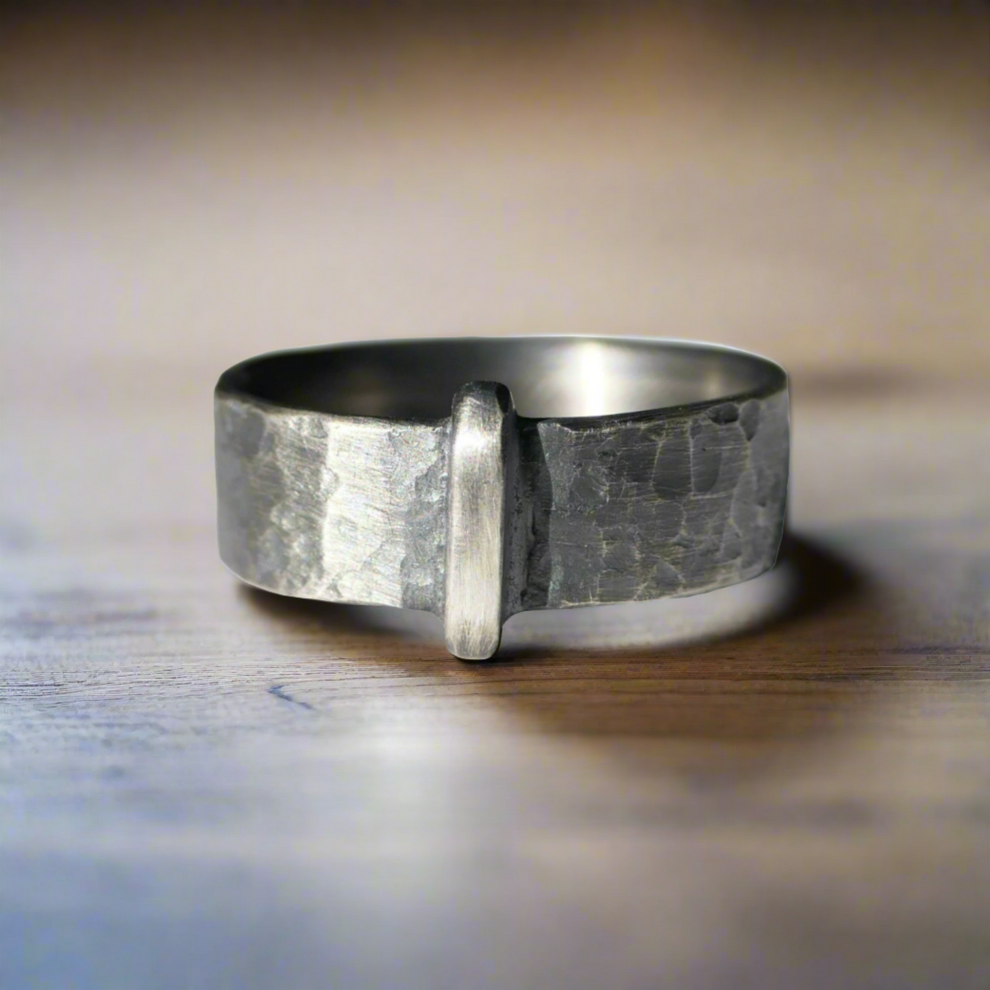 Rustic hammered sterling silver Scottish wedding band with antique finish and central ridge detail.