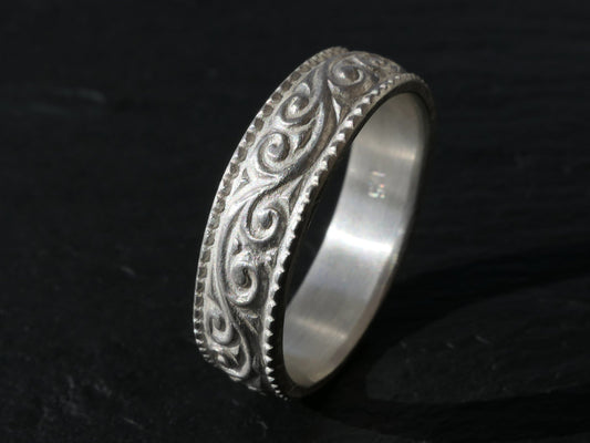 5.5mm sterling silver wedding band with intricate scroll pattern and durable design