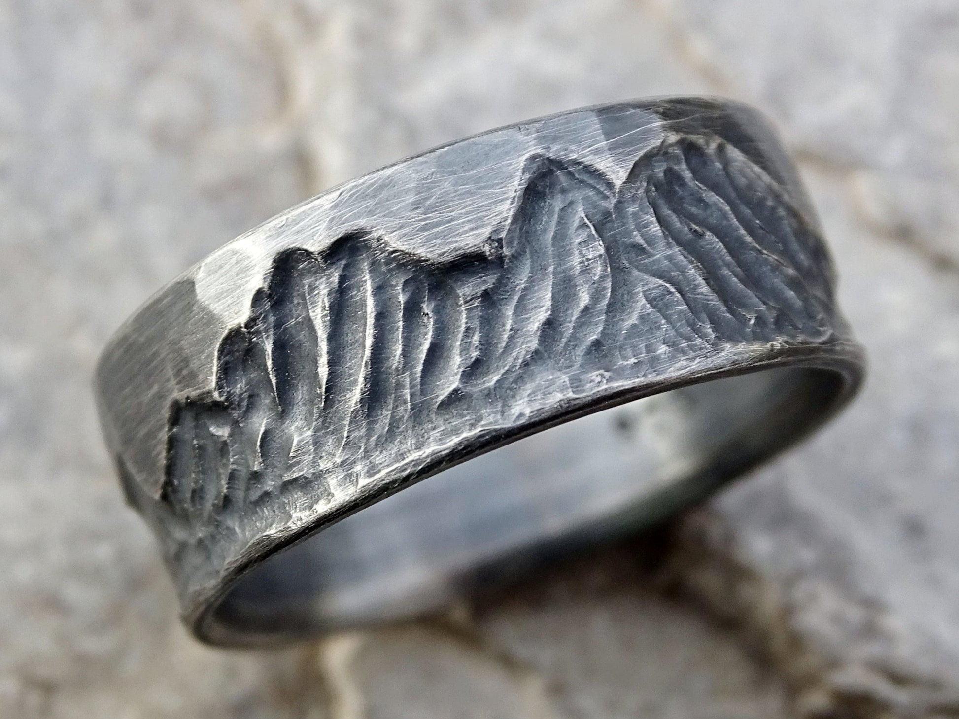 Sterling silver custom mountain ring with hand-engraved mountain range design around band