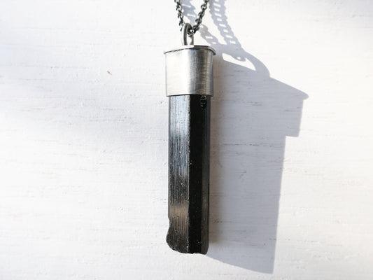 large black tourmaline crystal pendant in dark oxidized sterling silver setting with black silver chain