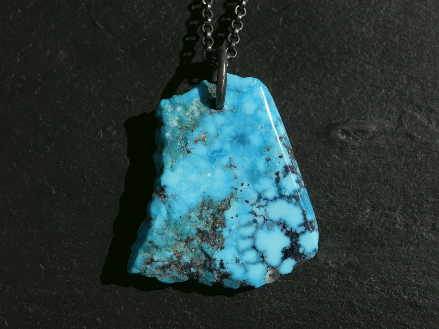bright blue Kingman turquoise nugget pendant on black sterling silver chain