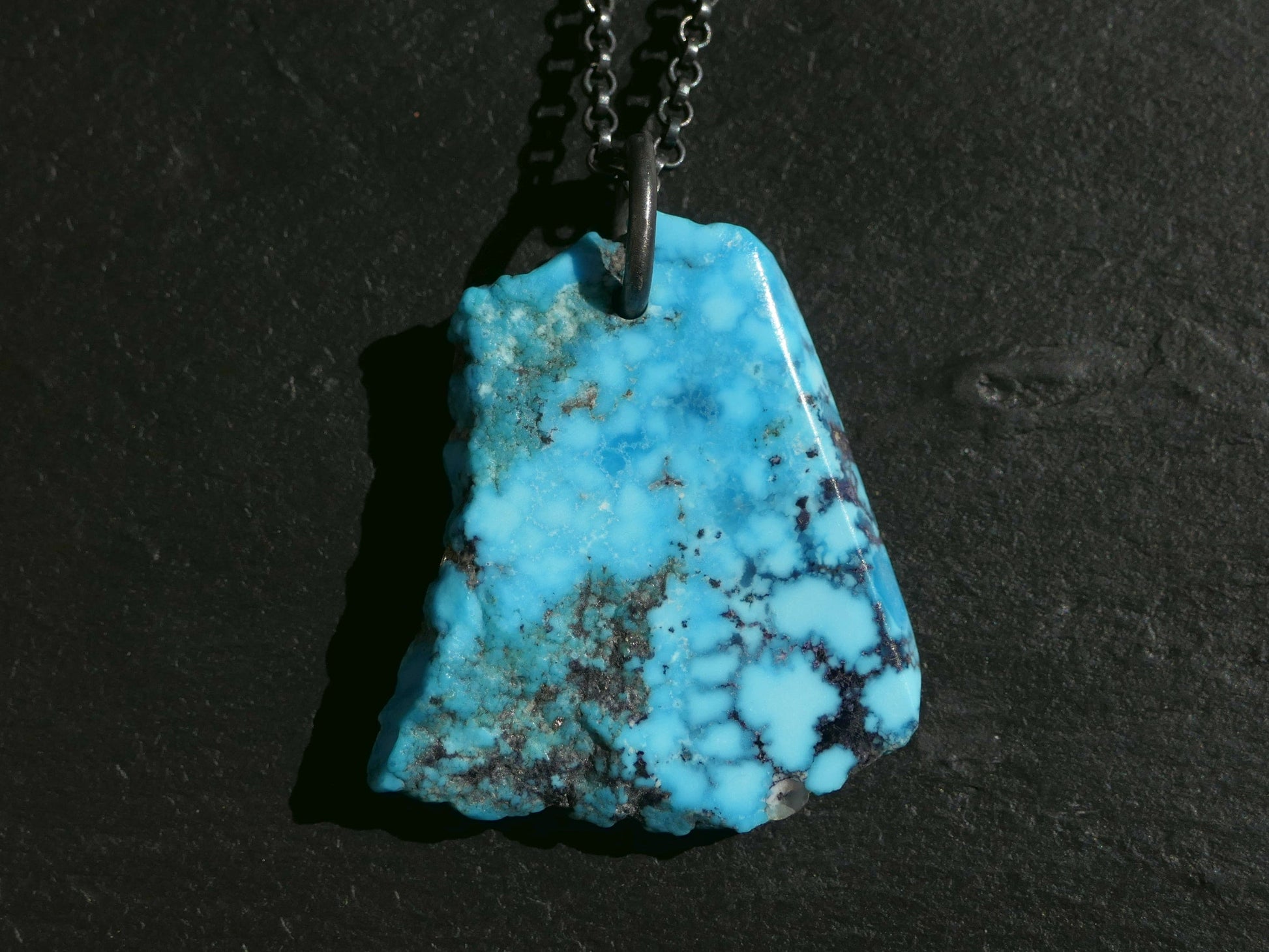 bright blue Kingman turquoise nugget pendant on black sterling silver chain