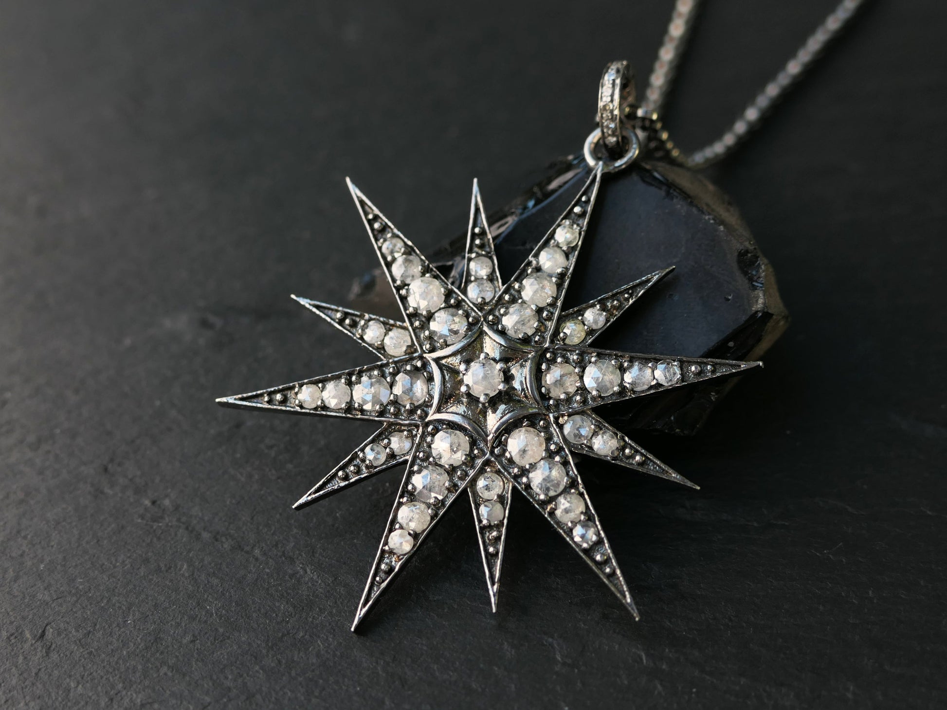 Large North Star pendant in black rhodium plated sterling silver with rose cut diamonds on a silver chain