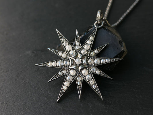 Large North Star pendant in black rhodium plated sterling silver with rose cut diamonds on a silver chain