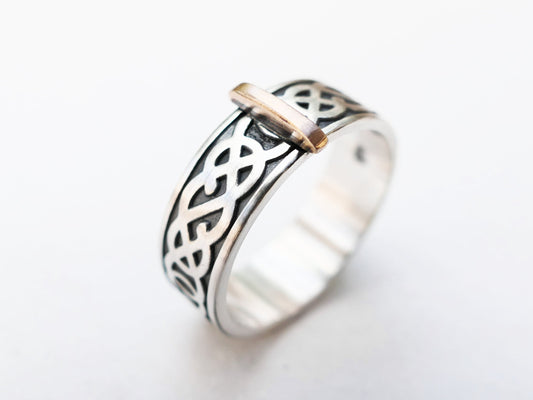 Sterling silver Celtic knot ring with bronze metal accent band, 7mm wide and 1.8mm thick, darkened detailing and 925 hallmark.