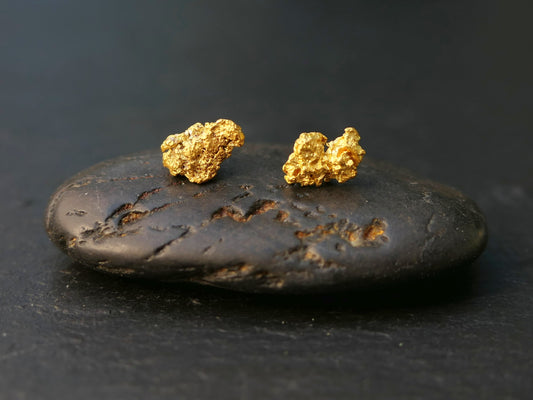 small gold stud earrings with natural Australian gold nuggets on black stone