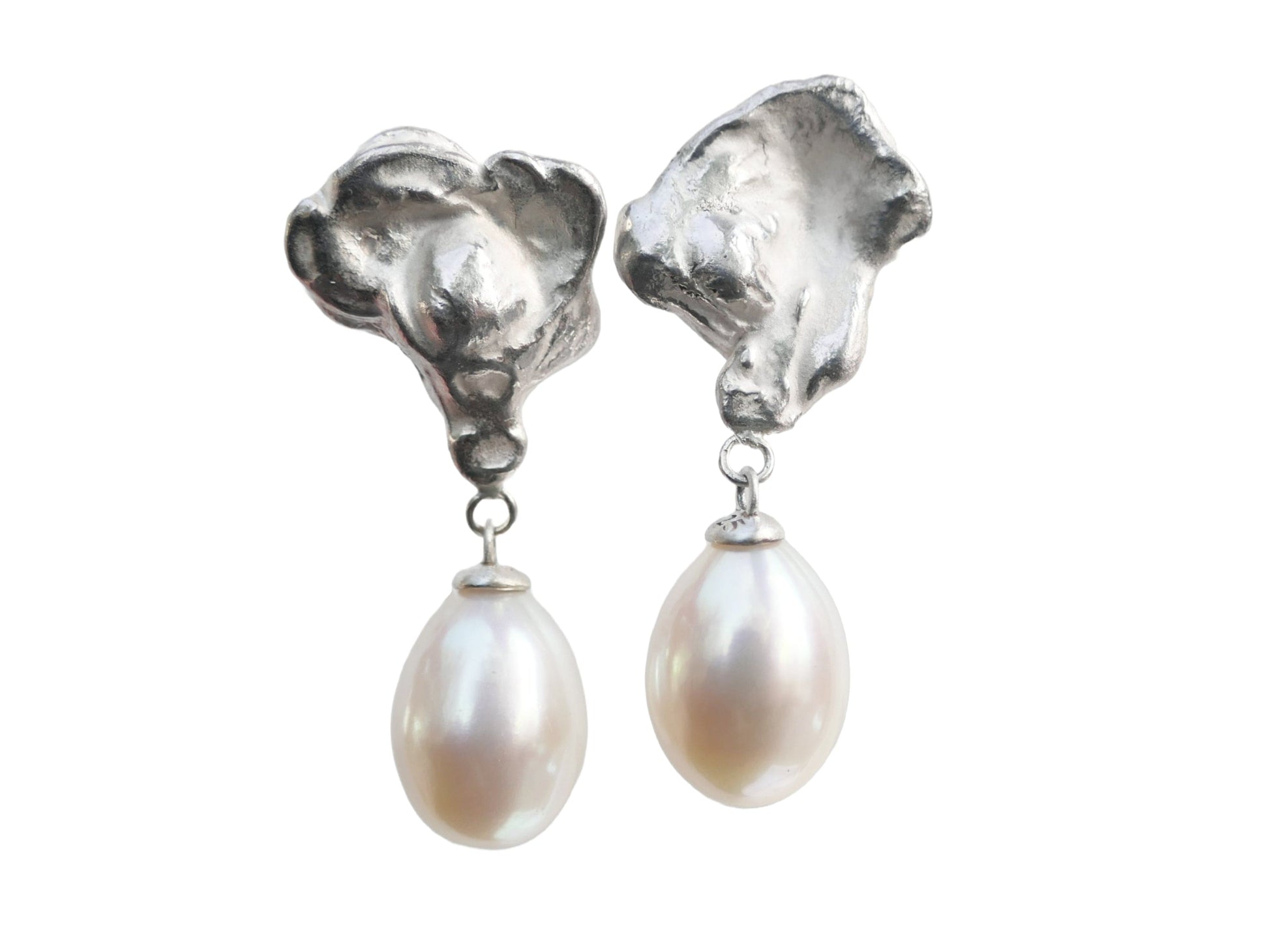 Sterling silver pearl dangle earrings with unique water cast tops and light pink cultured pearl teardrops.