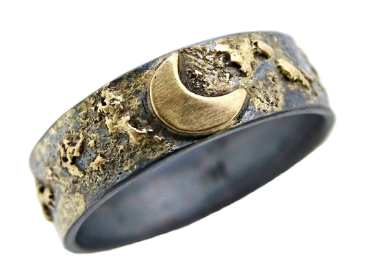 14k gold crescent moon ring on darkened sterling silver band with textured celestial design