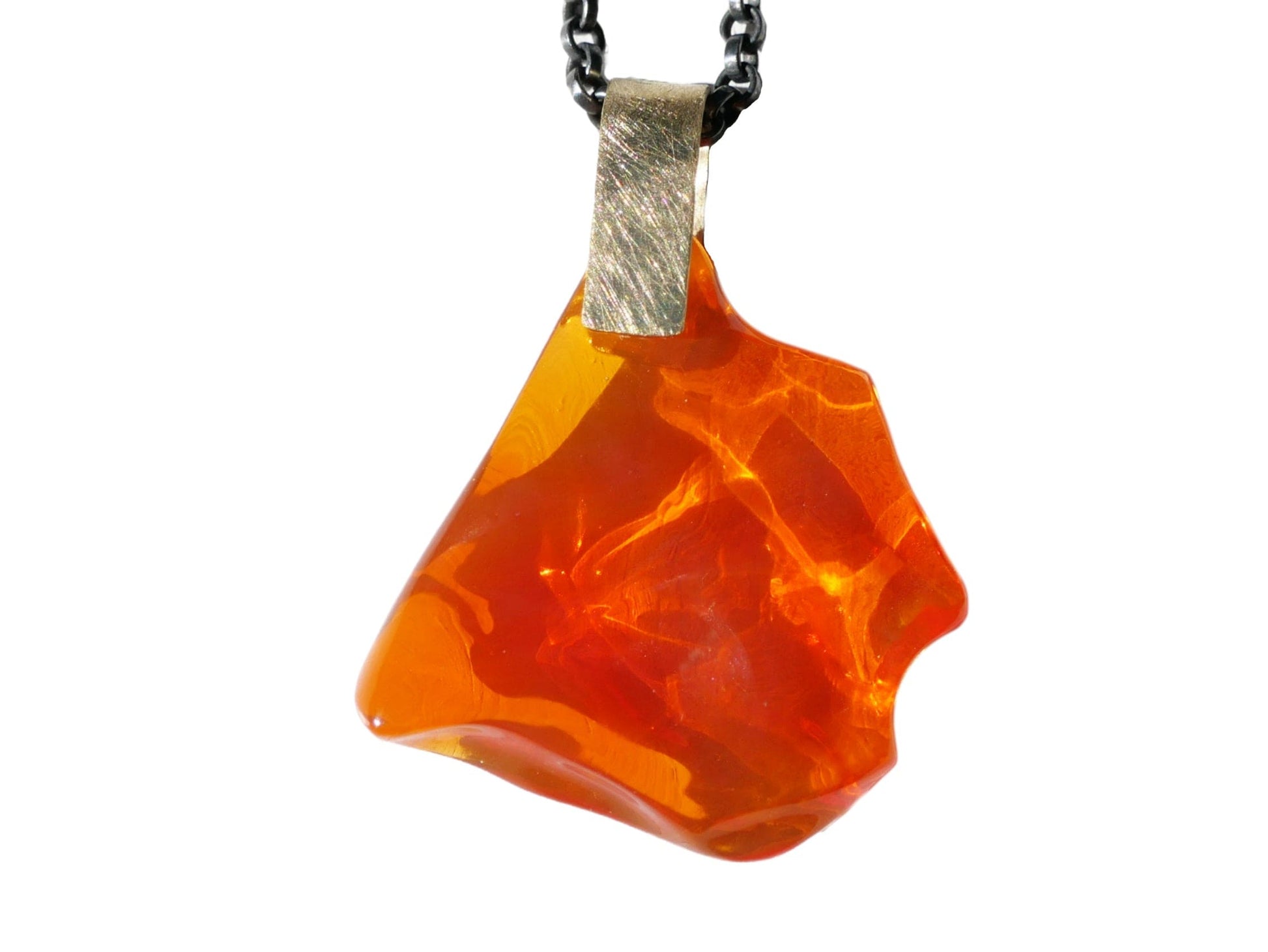Carved Mexican fire opal pendant with 18k yellow gold bail on black sterling silver chain