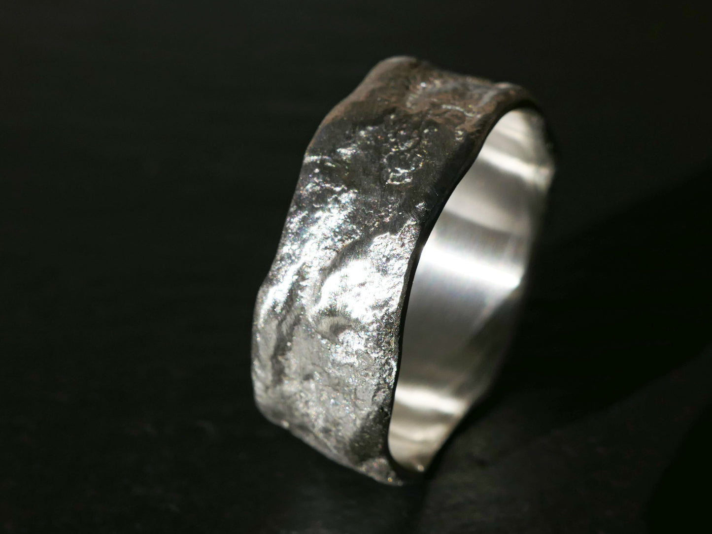 Unique textured sterling silver male wedding band with matte finish and rustic design