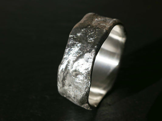 Unique textured sterling silver male wedding band with matte finish and rustic design