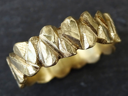 hand carved unique 14k gold wedding ring with rugged textured design and comfortable rounded edges