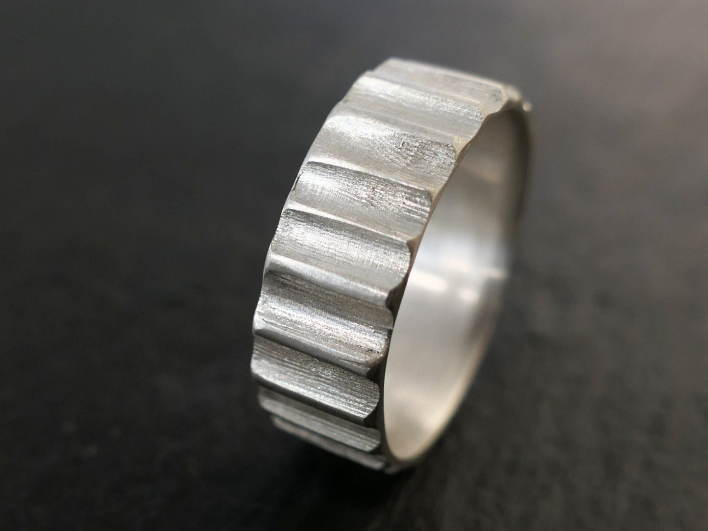 Sterling silver architecturally inspired gear ring with hand-carved textured band and mechanical design