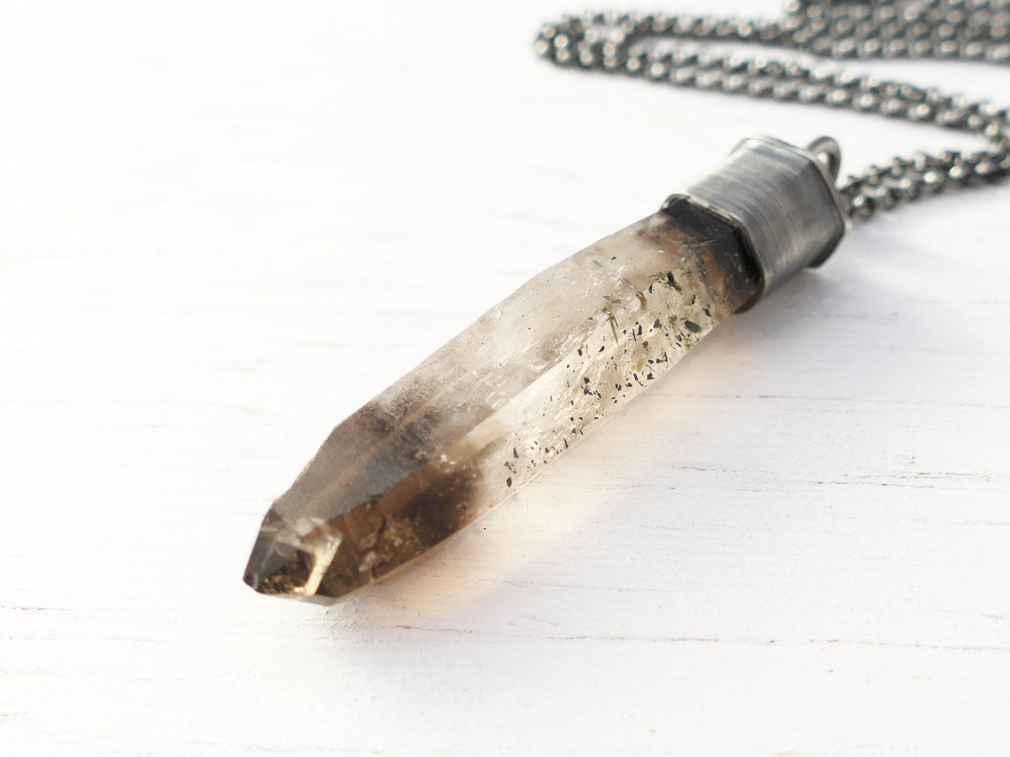 Natural smoky quartz crystal pendant set in oxidized sterling silver with black chain