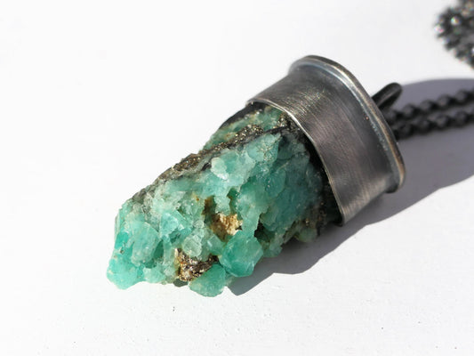 uncut emerald in matrix pendant with darkened sterling silver setting