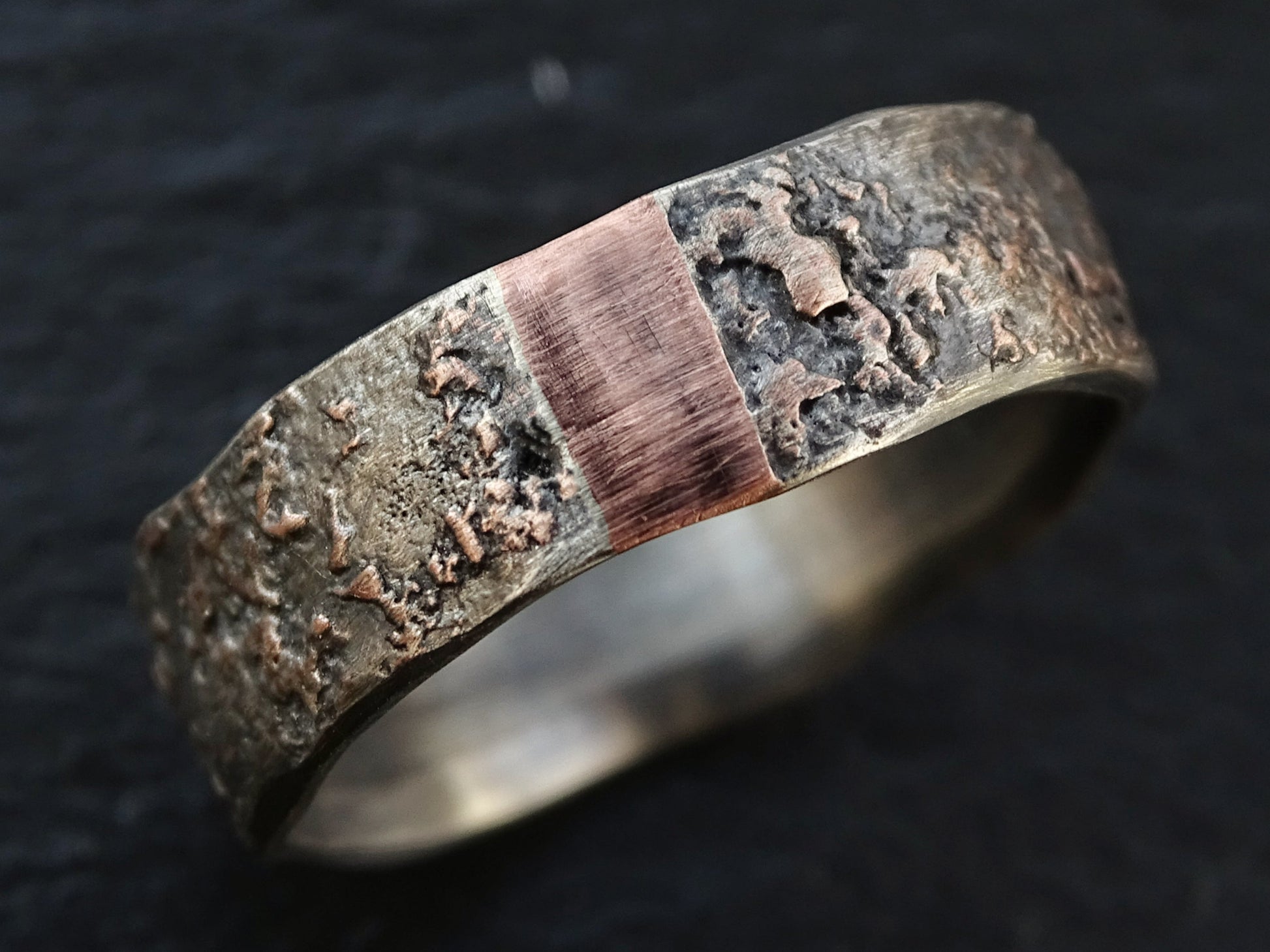 men's wedding ring with molten silver and copper design, rustic textured band with vivid color contrast