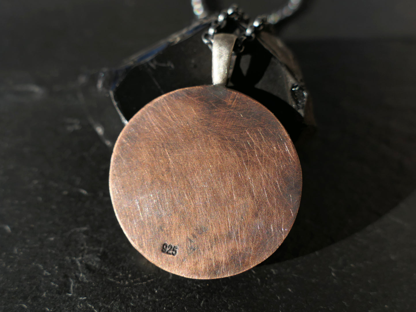 mountain range pendant back can be engraved