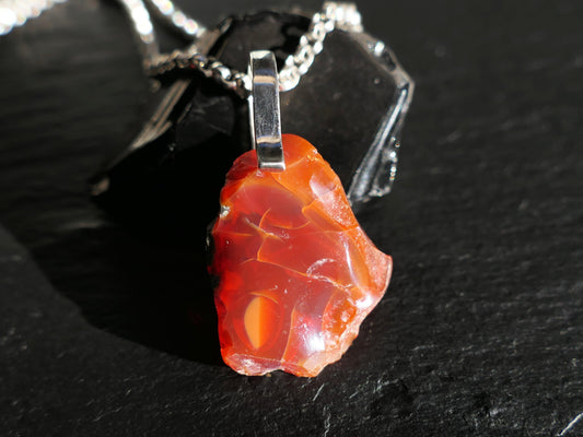 Uncut fire opal nugget pendant on sterling silver chain with fiery orange-red rough gemstone