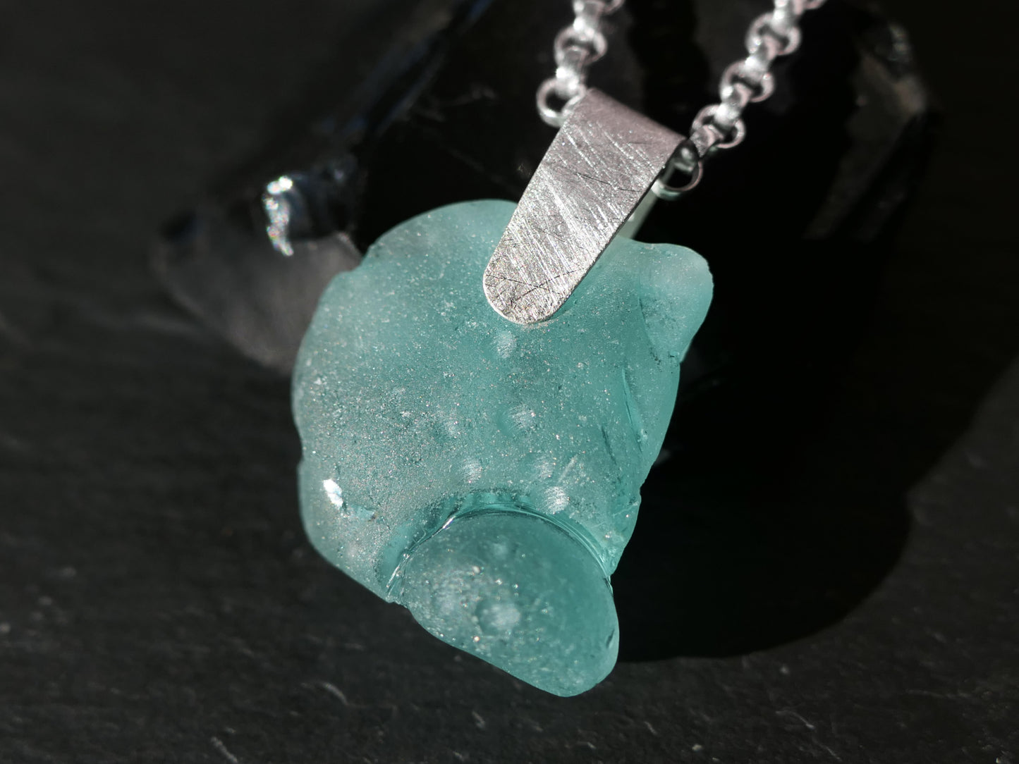 carved sea glass pendant